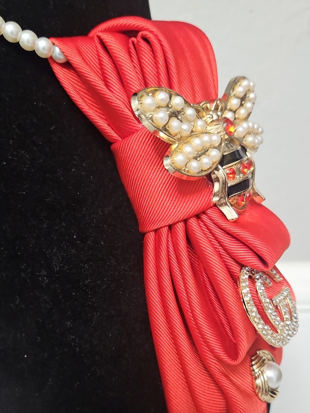 Upcycled Orange-Red Necktie Necklace with Gold Bee Brooch, GG and Pearl Accents - Picture 4 of 6